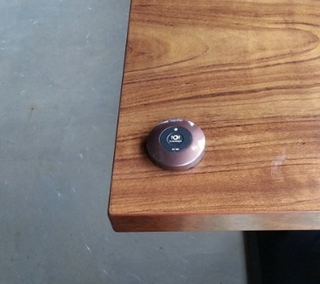 Call button used to request a server at a Korean restaurant